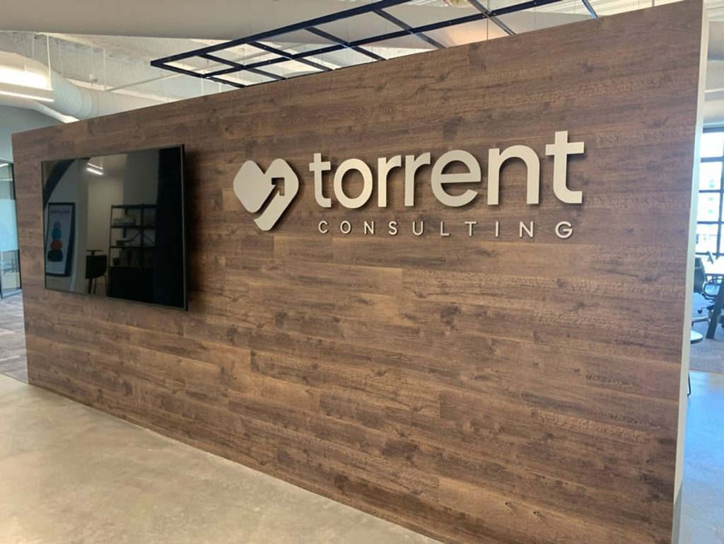 Brushed metal 3D wall letters mounted on an office wall in Nairobi